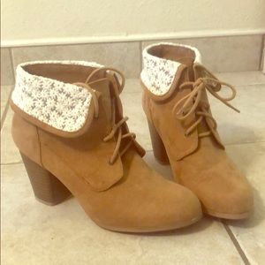 Tan booties with white floral pattern on top